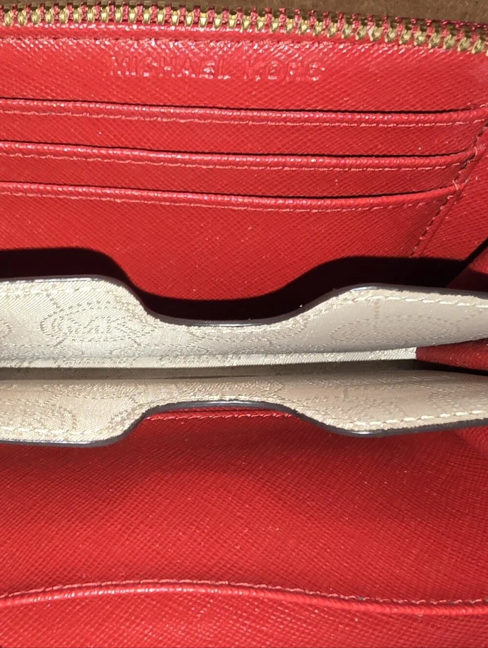 Michael Kors Red ostrich-patterned zip-around wallet featuring 1981 Goldtone